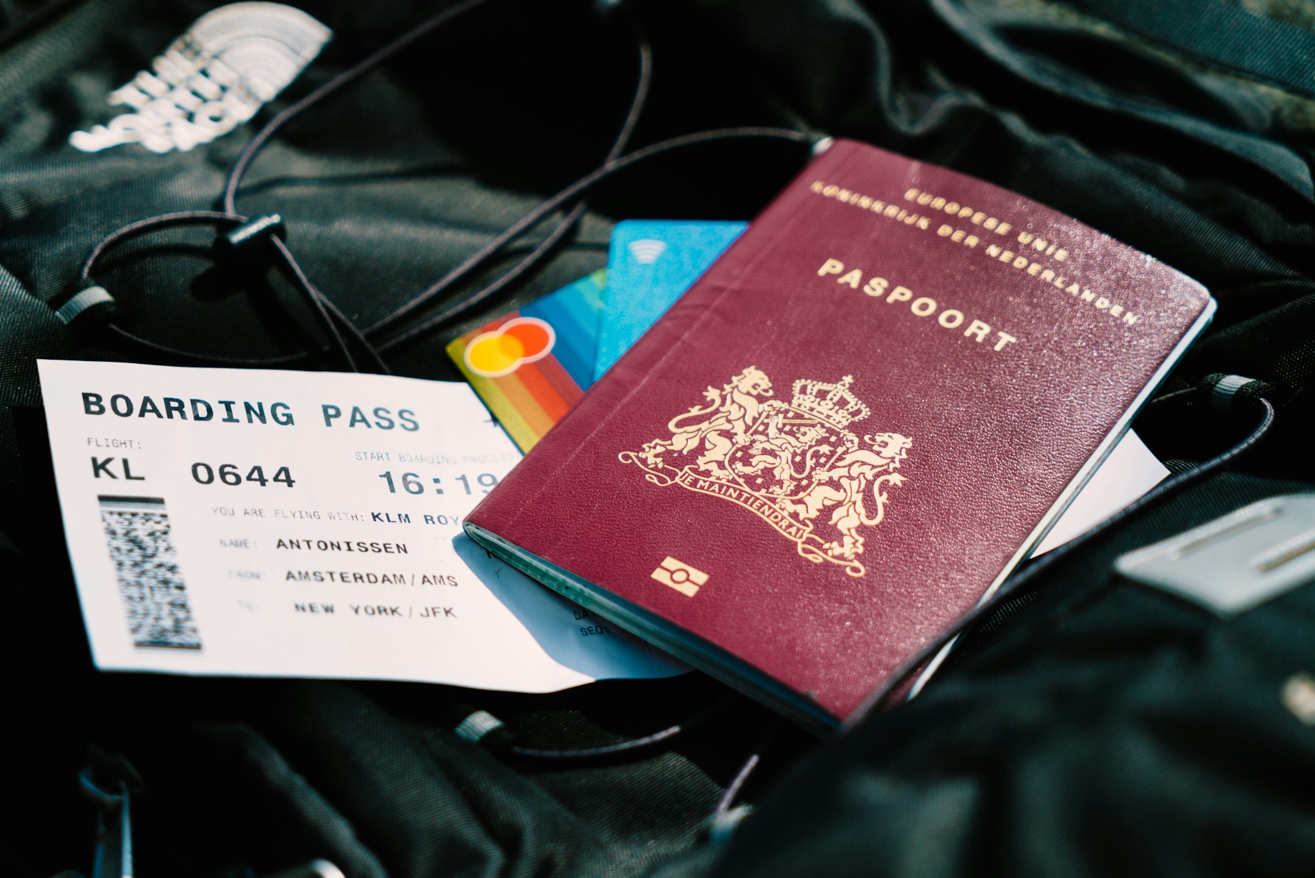 International travel documents checklist 2026 with passport and boarding pass on airport table