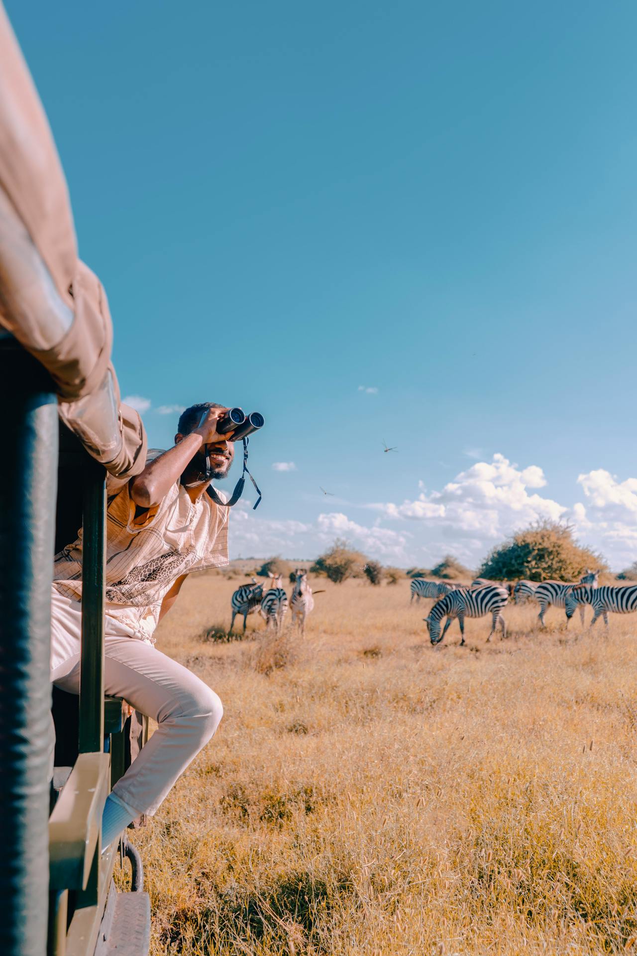 “Safari gear including binoculars and camera equipment